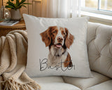 Personalised Brittany Spaniel name cushion on a chair by the window