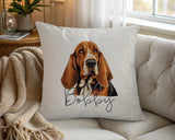 Personalised Basset Hound name cushion on a chair by the window