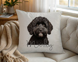 Personalised Black Cockapoo name cushion on a chair by the window