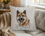Personalised Akita name cushion on a chair by the window