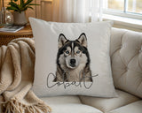 Personalised Alaskan Malamute name cushion on a chair by the window