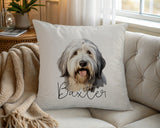 Personalised Old English Sheepdog name cushion on a chair by the window
