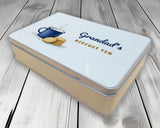 Biscuit tin personalised with a name, angled view showing the printed lid and metal tin