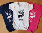 three baby onesuits with horse designs on them that say crawl, walk, trot