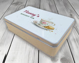 Biscuit tin personalised with a name, angled view showing the printed lid and metal tin